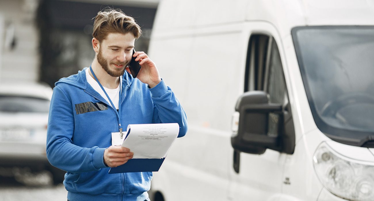 Delivery man with package outdoors